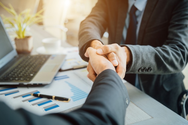 Photo business people shaking hands partner successful team leader and business  meeting.