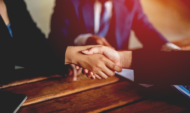 Business people shaking hands Show cooperation at the end of the meeting business communication business partners Success in business and leadership communication concept