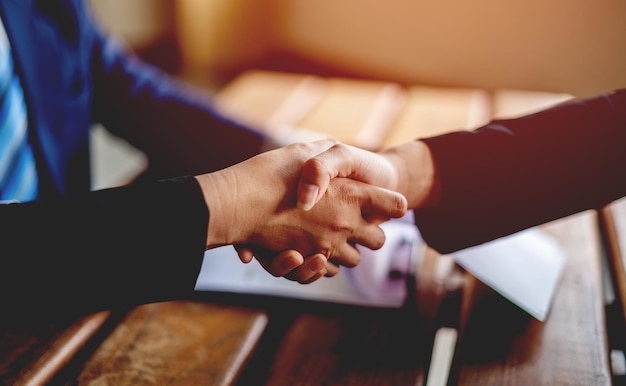 Business people shaking hands Show cooperation at the end of the meeting business communication