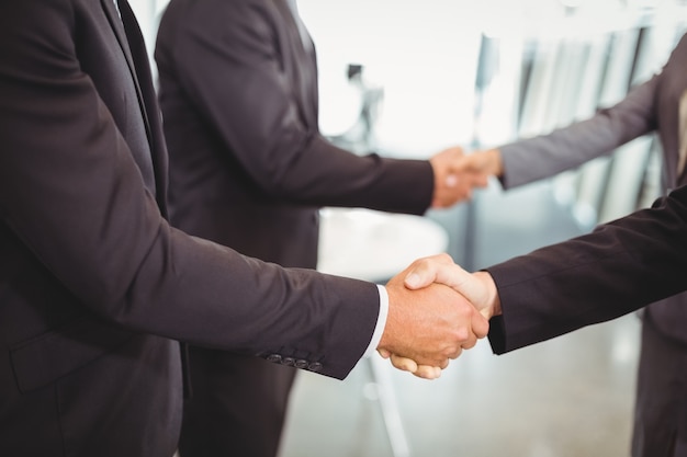 business people shaking hands with each other