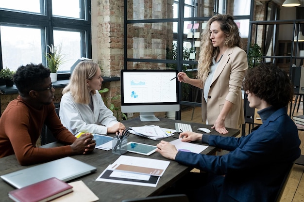 Business people sitting at presentation at office