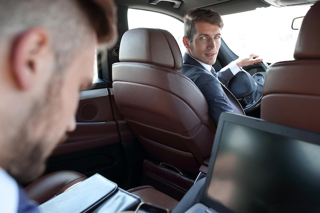 Business people sitting in a prestigious carpeople and technology