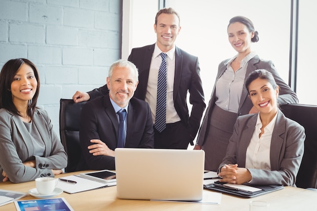 business people smiling in conference room