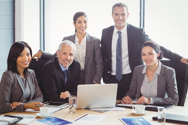 business people smiling in conference room