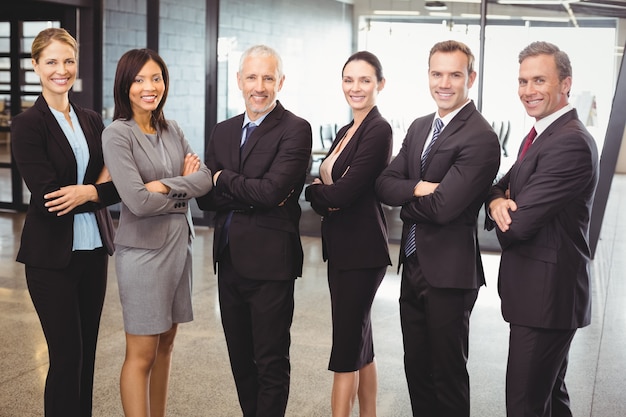 business people standing with arms crossed