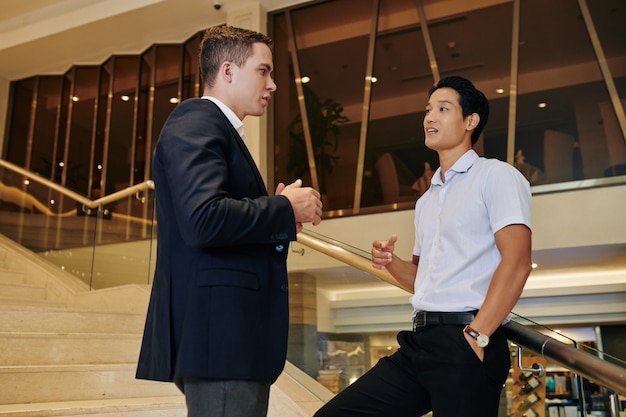 Business people talking on stairs