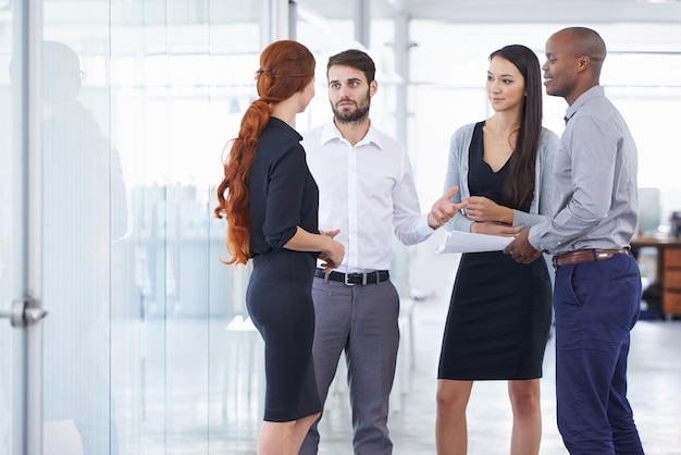 Business people team and discussion in office corridor with men women or diversity for strategy at startup Businessman leader or talk for collaboration teamwork or brainstorming for company goal