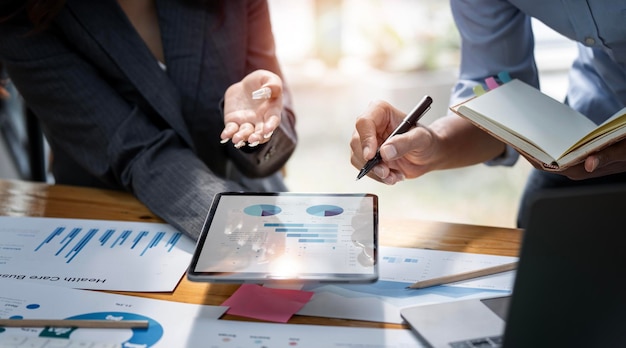 Business people team working at office with document on his desk doing planning analyzing the financial report business plan investment