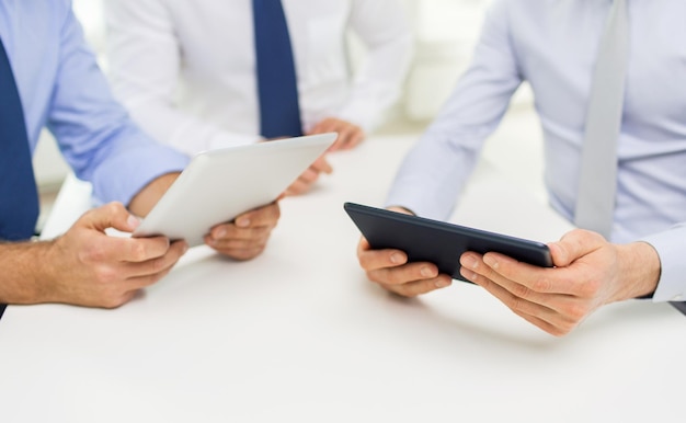 business, people, technology and teamwork concept - close up of businessman hands with tablet pc computer