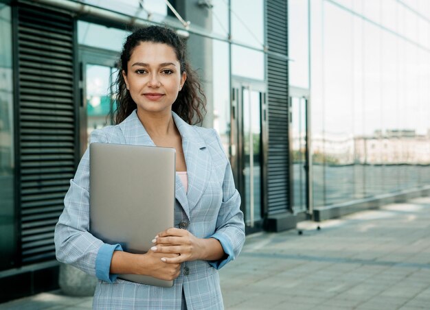 Business people tehnology and lifestyle concept portrait of a young African American woman with laptop