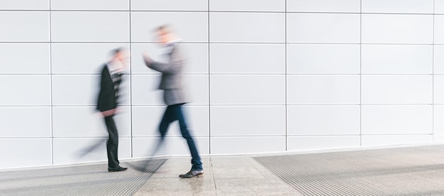 business people walking in a office floor, including copy space. ideal for websites and magazines layouts