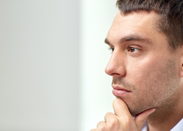 business, people and work concept - close up of businessman male face