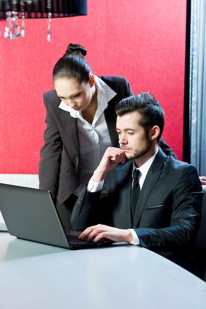 Business people at work in office.