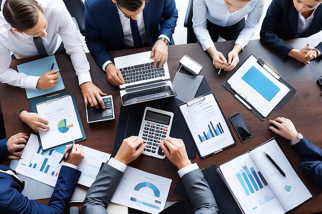 Photo business people working in a meeting one of which has a graph on it