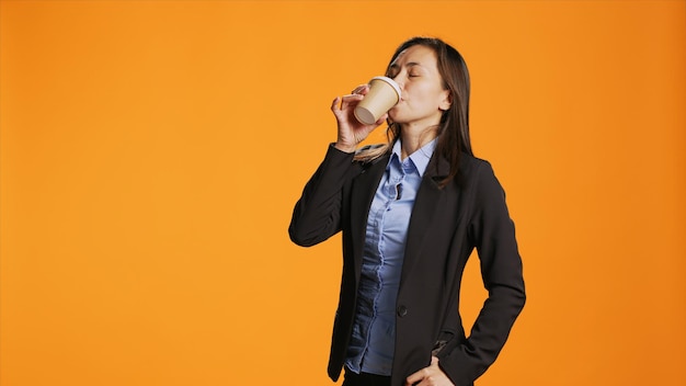 Business person enjoying cup of coffee on office break