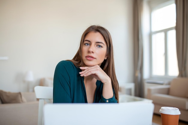 Business professionals Business woman analyzing data using computer while spending time in the office Beautiful young grinning professional Black woman in office Graphs and charts