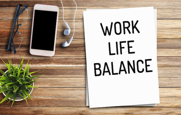 Photo business quotes work life balance on notebook or paper in office desk office workplace