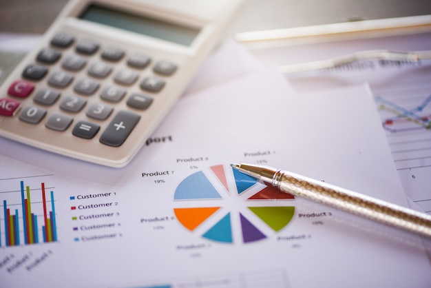 Business report chart preparing graphs calculator concept 