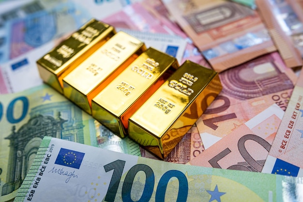 Business and saving concept euro money with gold bars