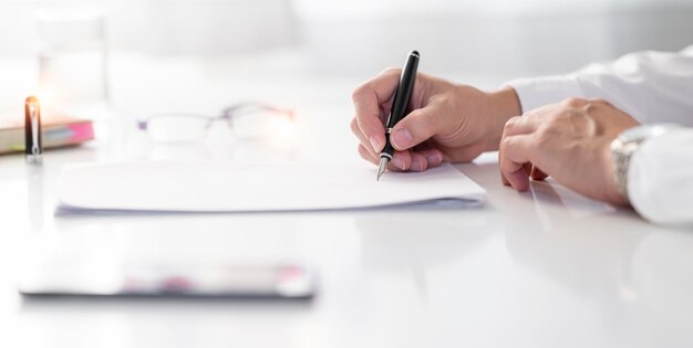 Business signing contact Executive businessman signing a contract in office