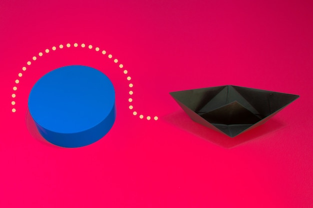 Business for solution concept. Black paper boat with blue plastic block