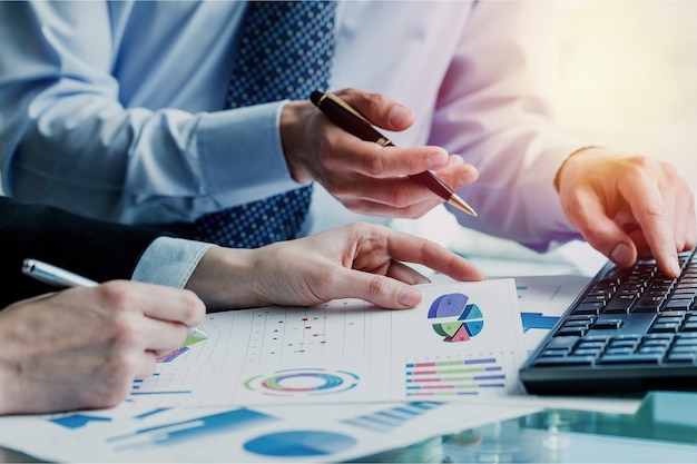 Business startup analysis summary report graph and using a calculator to calculate the numbers.