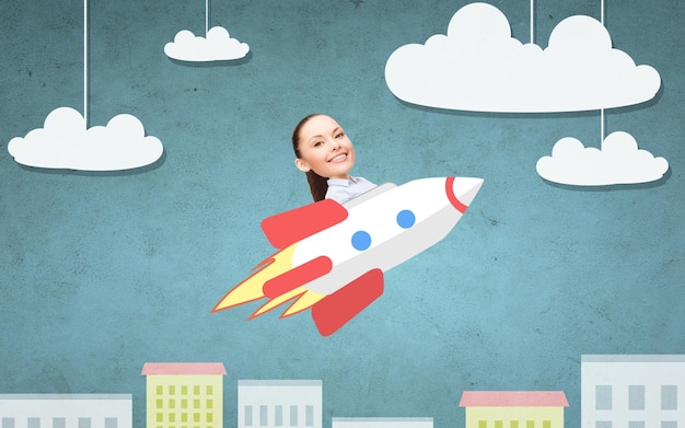 business, startup, development and people concept - businesswoman flying on rocket above cartoon city