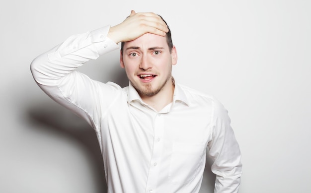 Photo business success and people concept young business man wearing white shirt isolated on white