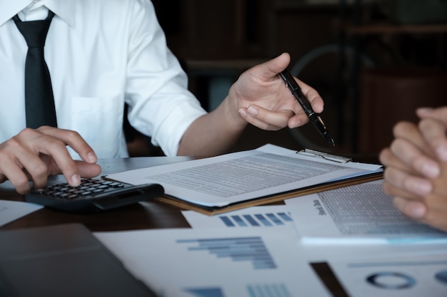 Business team analyzing income charts and graphs