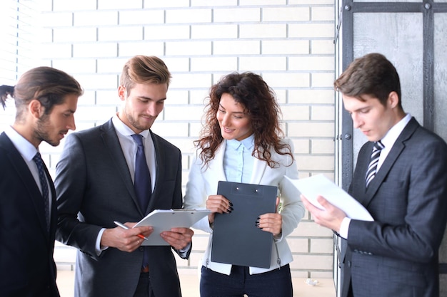 Business team discussing together business plans in office