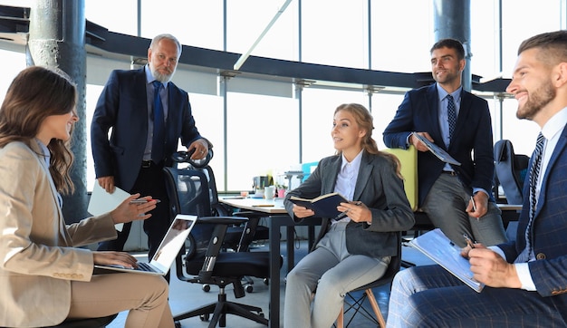 Business team discussing together business plans in office