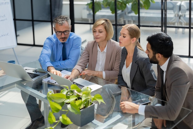 Business team discussing together business plans in office