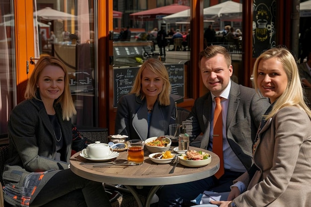 Business team has lunch in a street cafe