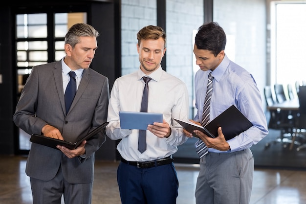 business  team interact using digital tablet and organizer in the office