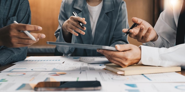 Business team meeting and discussing project plan Businessmen discussing together in meeting room Professional investor working with business project together