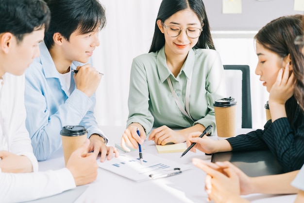 The business team members are discussing next month's plans together