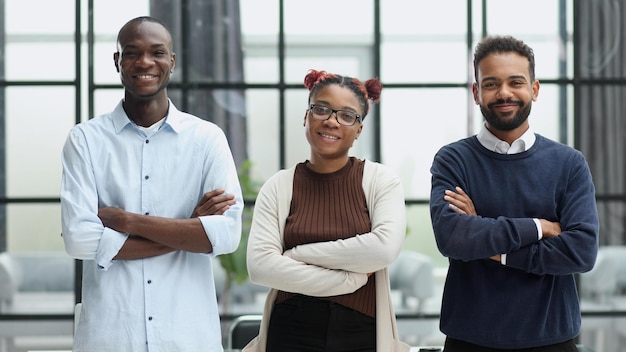 Business team in an office smiling at the camera