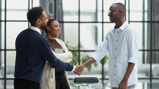 Business team in an office smiling at the camera