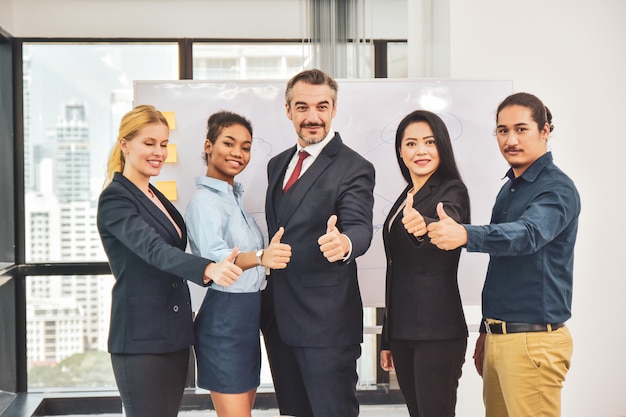 Business team standing in meeting room