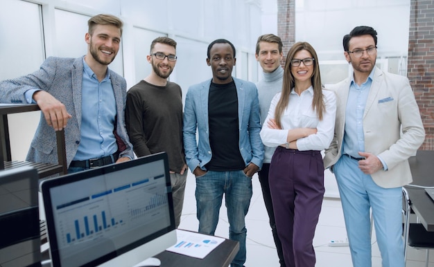 Business team standing in a modern officethe concept of teamwork