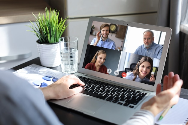 Business team working from home using laptop