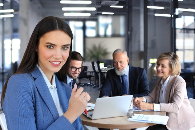 Business team working on laptop to check the results of their work