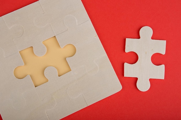 Business Teamwork Concept Jigsaw Puzzle Pieces on red background