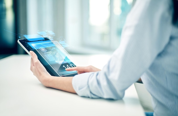 business, technology, communication and people concept - close up of woman with tablet pc computer networking at office or home