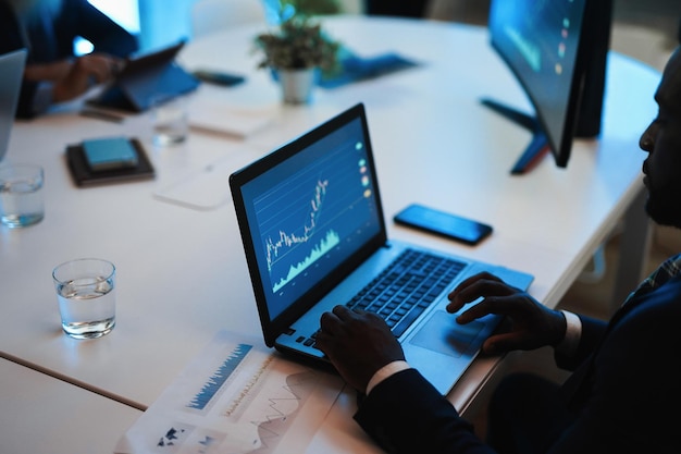 Business trader team doing blockchain analysis inside hedge fund office  Focus on african man left hand