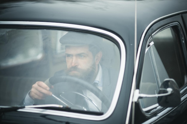 Business trip of bearded man in retro car business trip and traveling concept