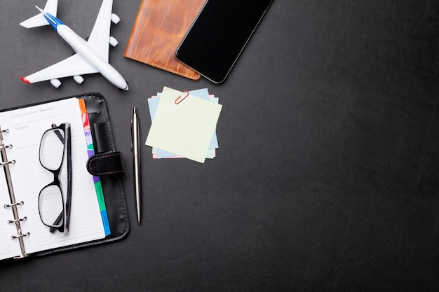 Photo business trip concept accessories on desk table