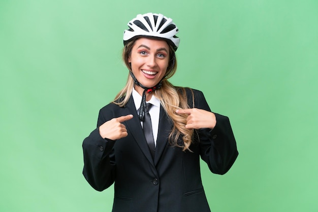 Business Uruguayan woman wearing a helmet biker over isolated background with surprise facial expression