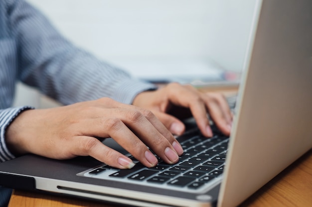 Business woman or accountant working Financial investment on laptop.