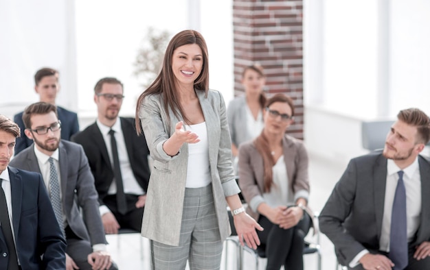 Business woman asks a question at a business meeting